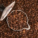 coffee beans in mocha pot with copy space